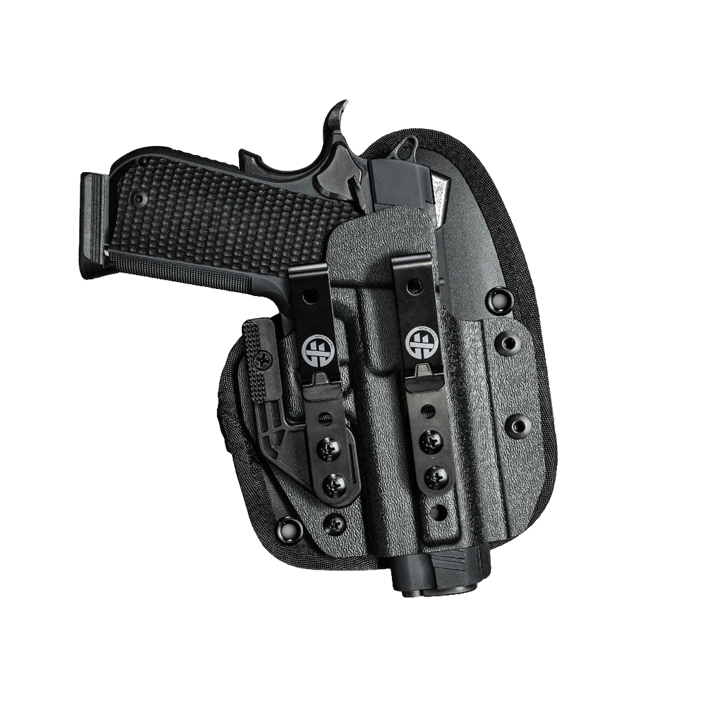 A black tactical holster shown with a handgun inserted, photographed on a transparent background. The holster has a textured finish, a belt clip, and visible logo markings.