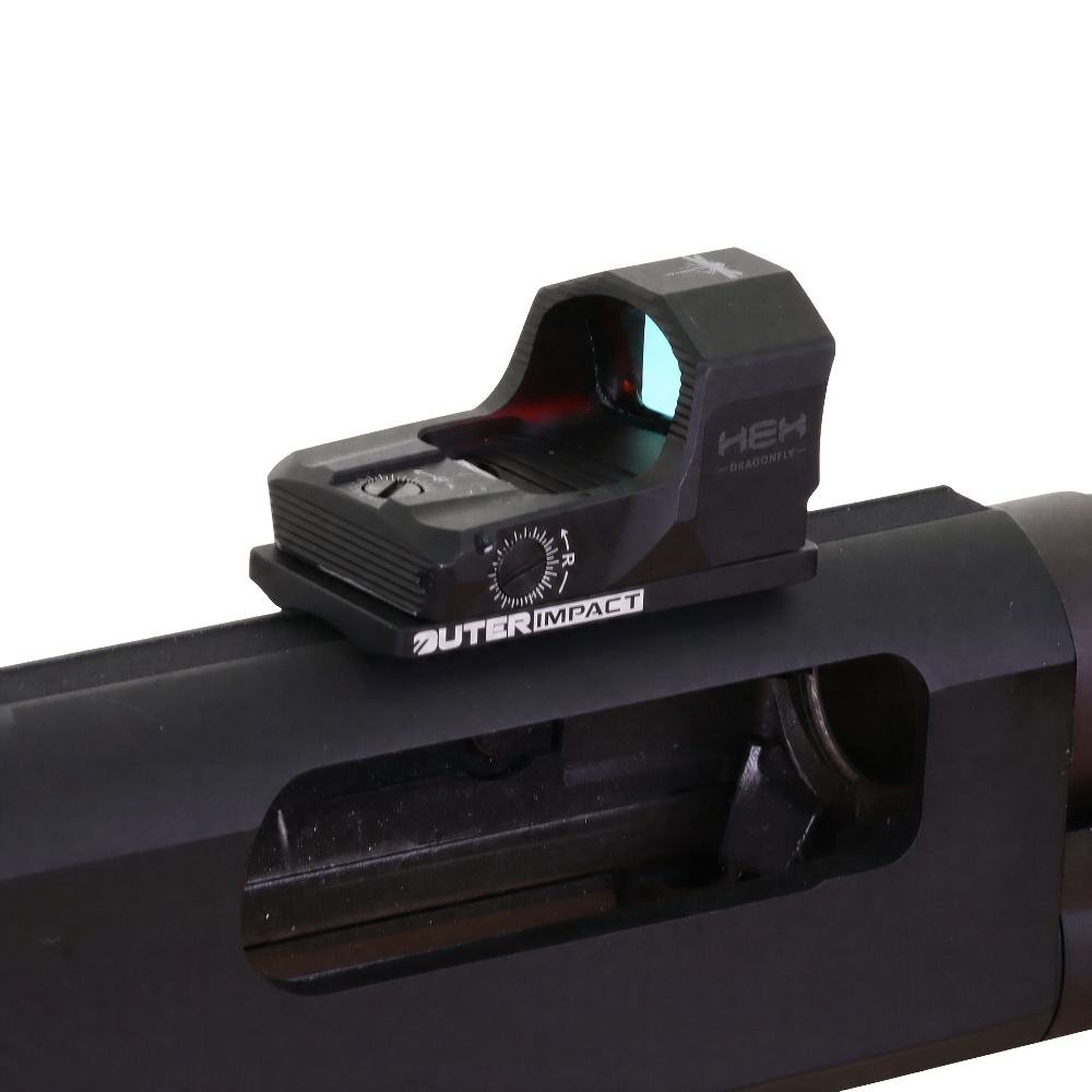 A close-up of a black OUTER IMPACT HEW 3 Red Dot Sight mounted on the receiver of a black firearm, shown against a transparent background.