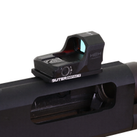 A close-up of a black OUTER IMPACT HEW 3 Red Dot Sight mounted on the receiver of a black firearm, shown against a transparent background.