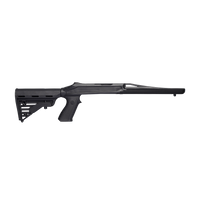 Full-length right-side profile view of a matte black synthetic tactical shotgun stock chassis featuring an adjustable buttstock, pistol grip, and integrated top-picatinny rail barrel shroud, isolated on a transparent background.
