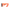 Bright orange polymer rifle stock with a black honeycomb-patterned butt pad, shown on a transparent background.