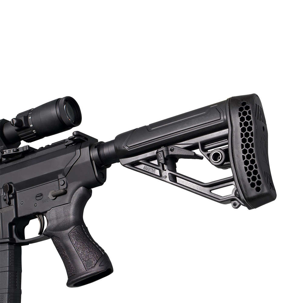 A close-up studio shot of a black tactical rifle with an attached scope, showing the receiver, pistol grip, and a black adjustable buttstock with a honeycomb-patterned vent on the rear, set against a transparent background.