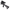 A black tactical rifle with an attached scope, handguard, and adjustable stock, shown on a transparent background.