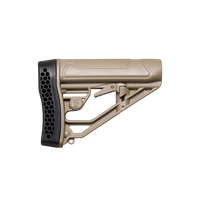A tan molded polymer rifle stock with a black textured honeycomb-patterned butt pad, shown from a side profile on a transparent background.